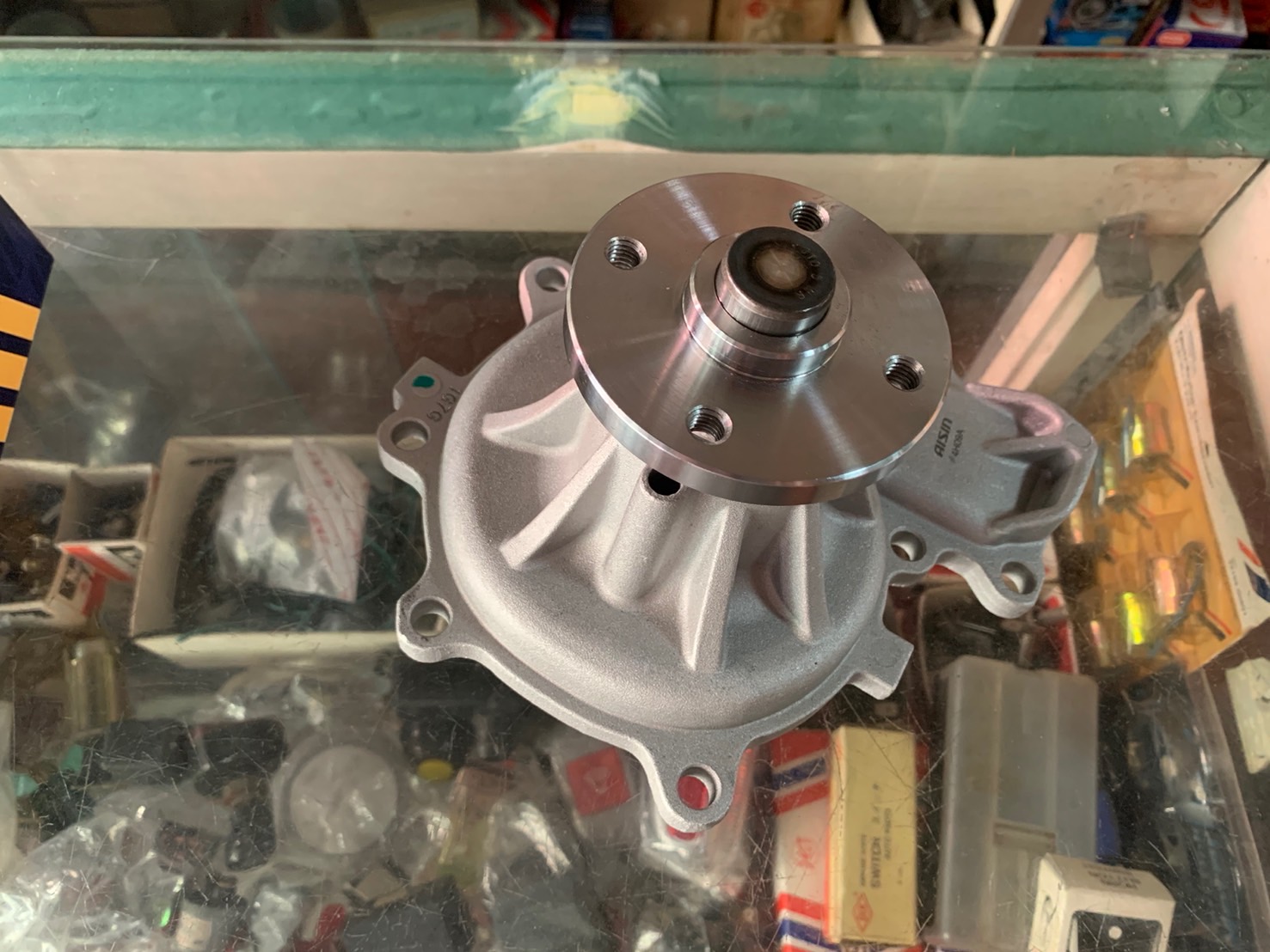 ปั๊มน้ำ ISUZU ELF 4HK1 AISIN
