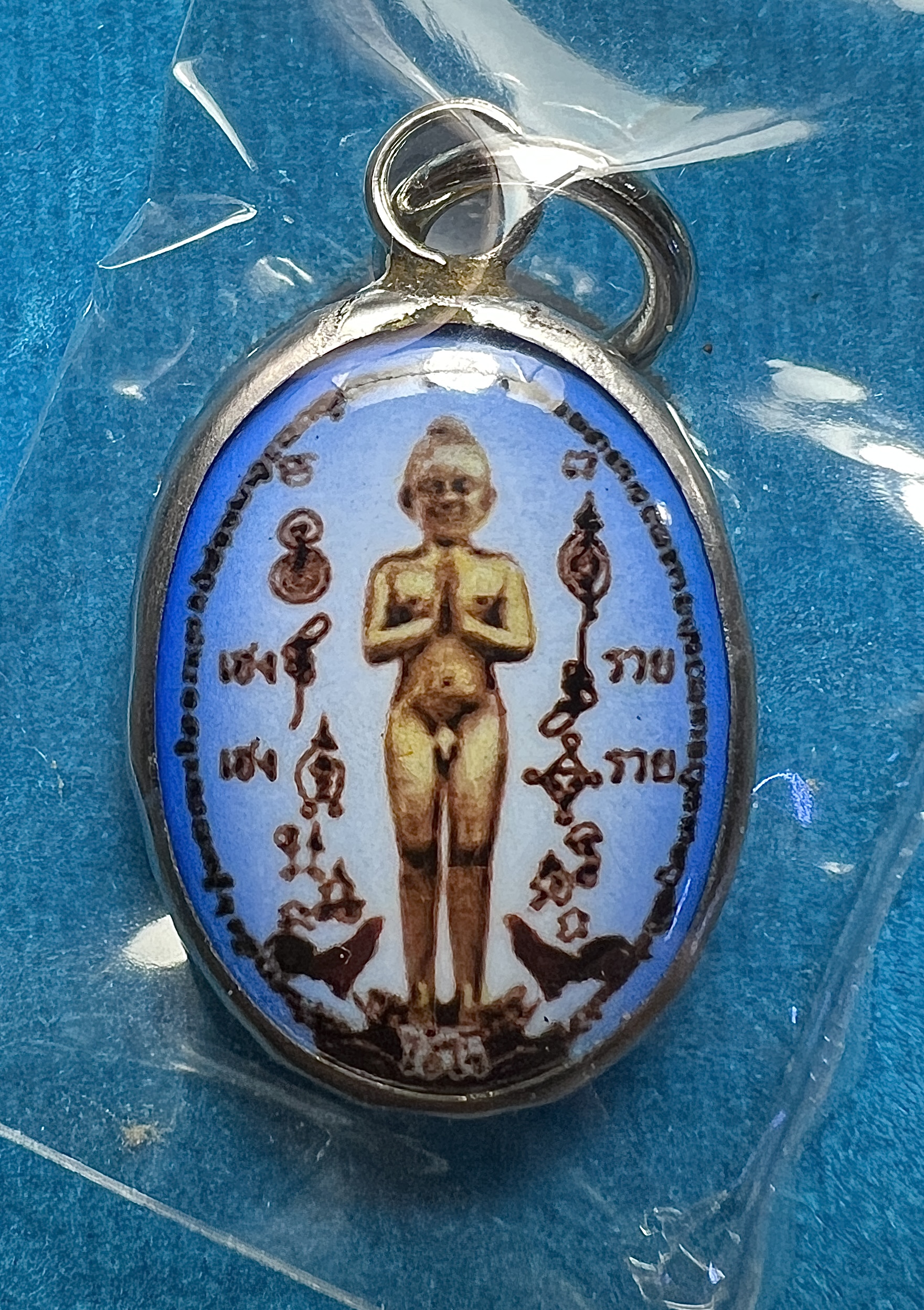 ล็อกเก็ตไอ้ไข่ (เลี่ยมแสตนเลจ, สีฟ้า) Ai-Kai locket (Stainless cover, Blue color) SKU-02679